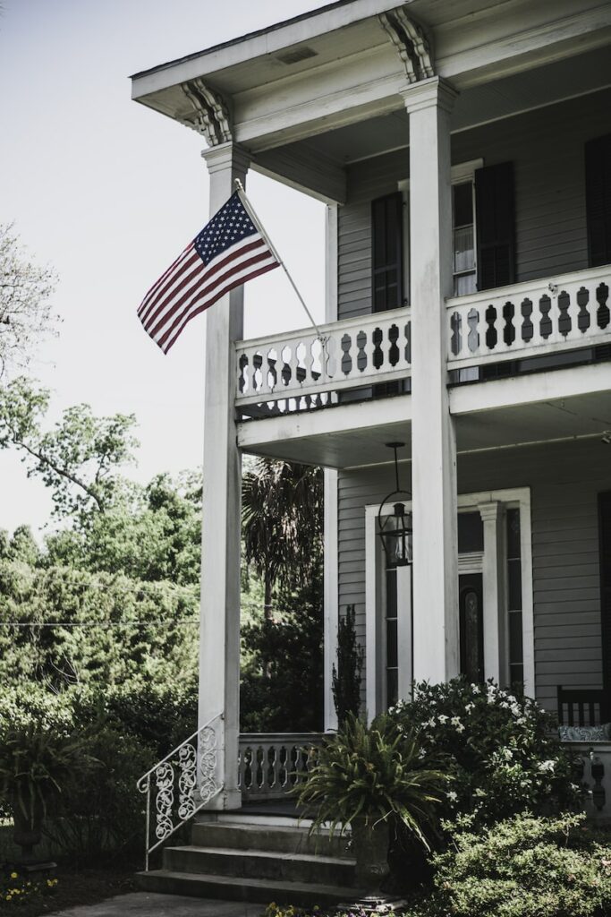 How can I keep my porch flags from blowing away in strong winds